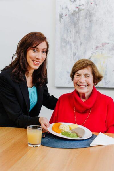 lisa sossen with patient and texture modified meal