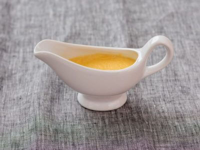 moderately thick mustard sauce in a jug