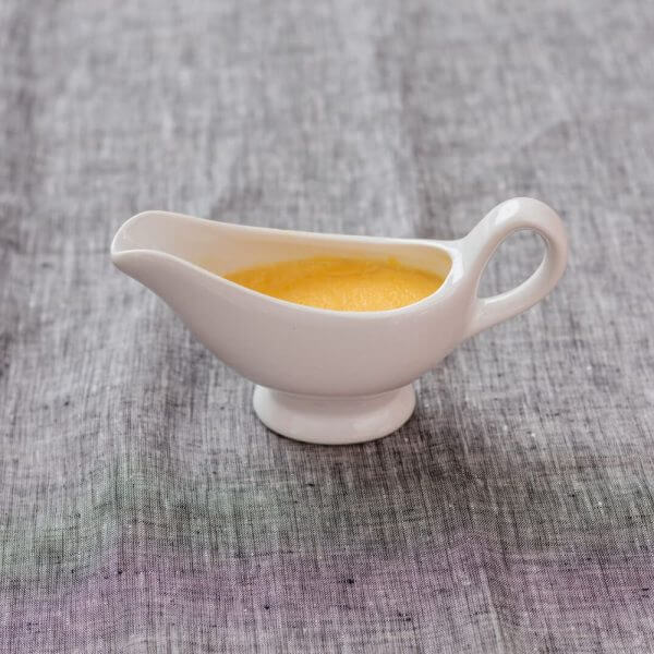 moderately thick mustard sauce in a jug