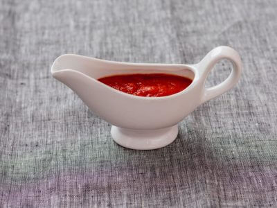 moderately thick tomato sauce in a jug