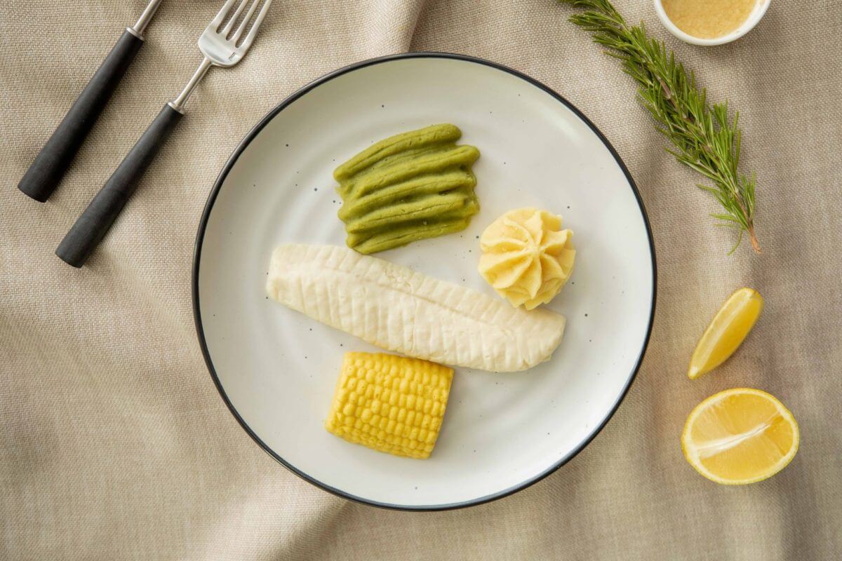 Texture modified fish fillet and vegetables on a plate