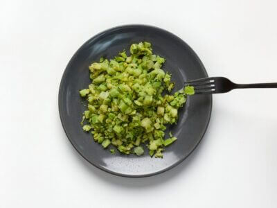 soft and bite-sized broccoli on a plate with fork