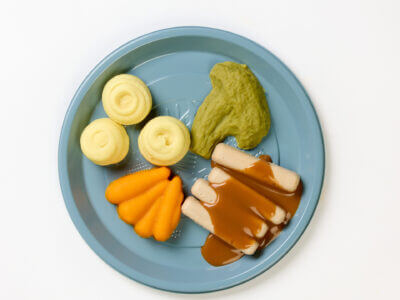 level 4 pork chipolata sausages and vegetables pre-plated meal