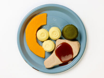 level 4 pork chop and vegetables pre-plated meal